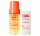A bottle of Eleven Australia Miracle Hair Treatment Oil Elixir with a coral cap next to a white stick of Eleven Australia Smooth Me Now Flyaway Hair Balm, on a white background.