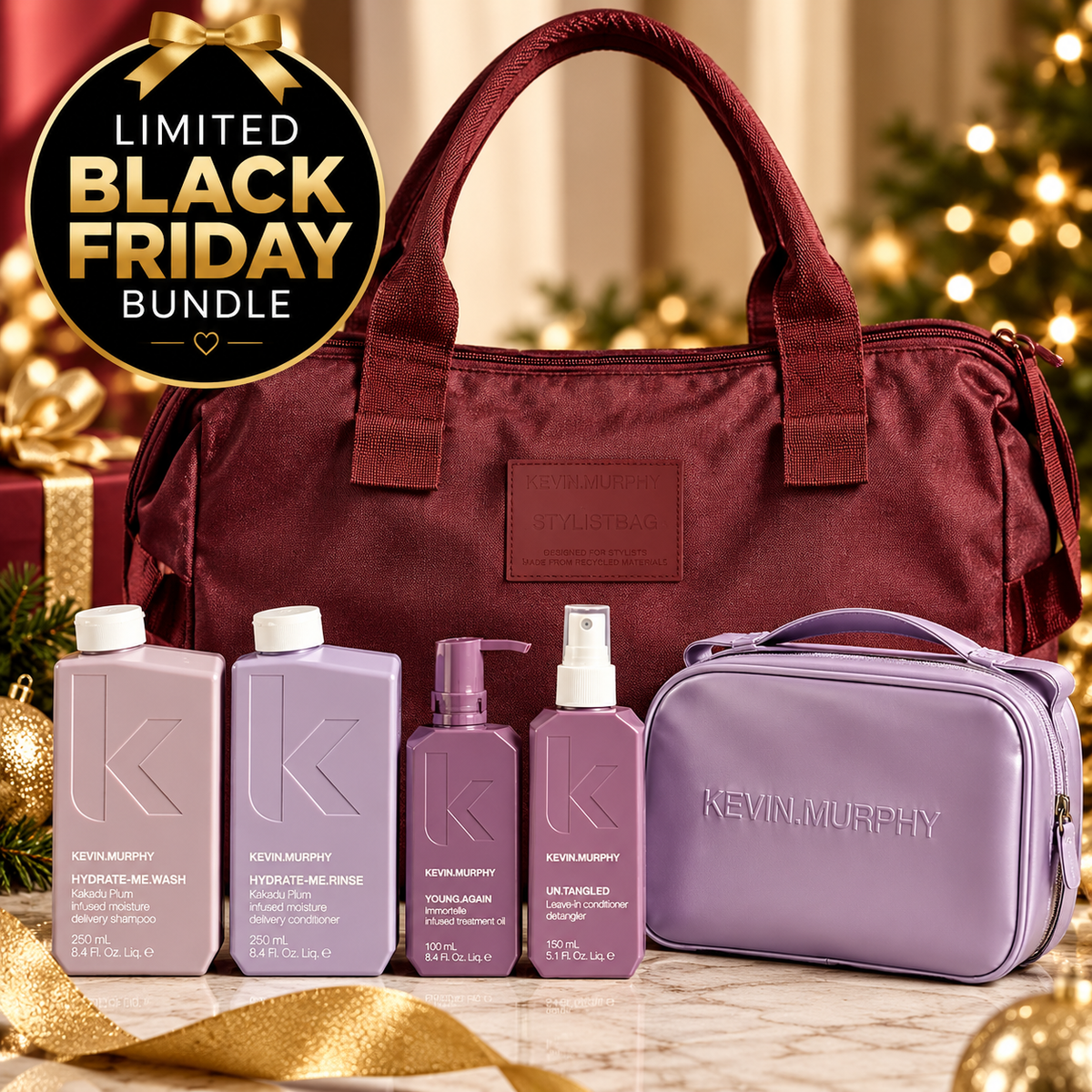 A Kevin Murphy Black Friday bundle featuring a burgundy tote bag, four purple and lavender Kevin Murphy skincare bottles, and a matching lavender toiletry case, arranged on a marble surface with a gold 'Limited Black Friday Bundle' badge and a blurred Christmas tree in the background.