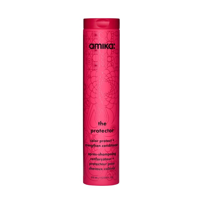 A tall, cylindrical pink bottle of amika. The protector color protectant styling conditioner, featuring black text and a subtle floral pattern on a clean white background.
