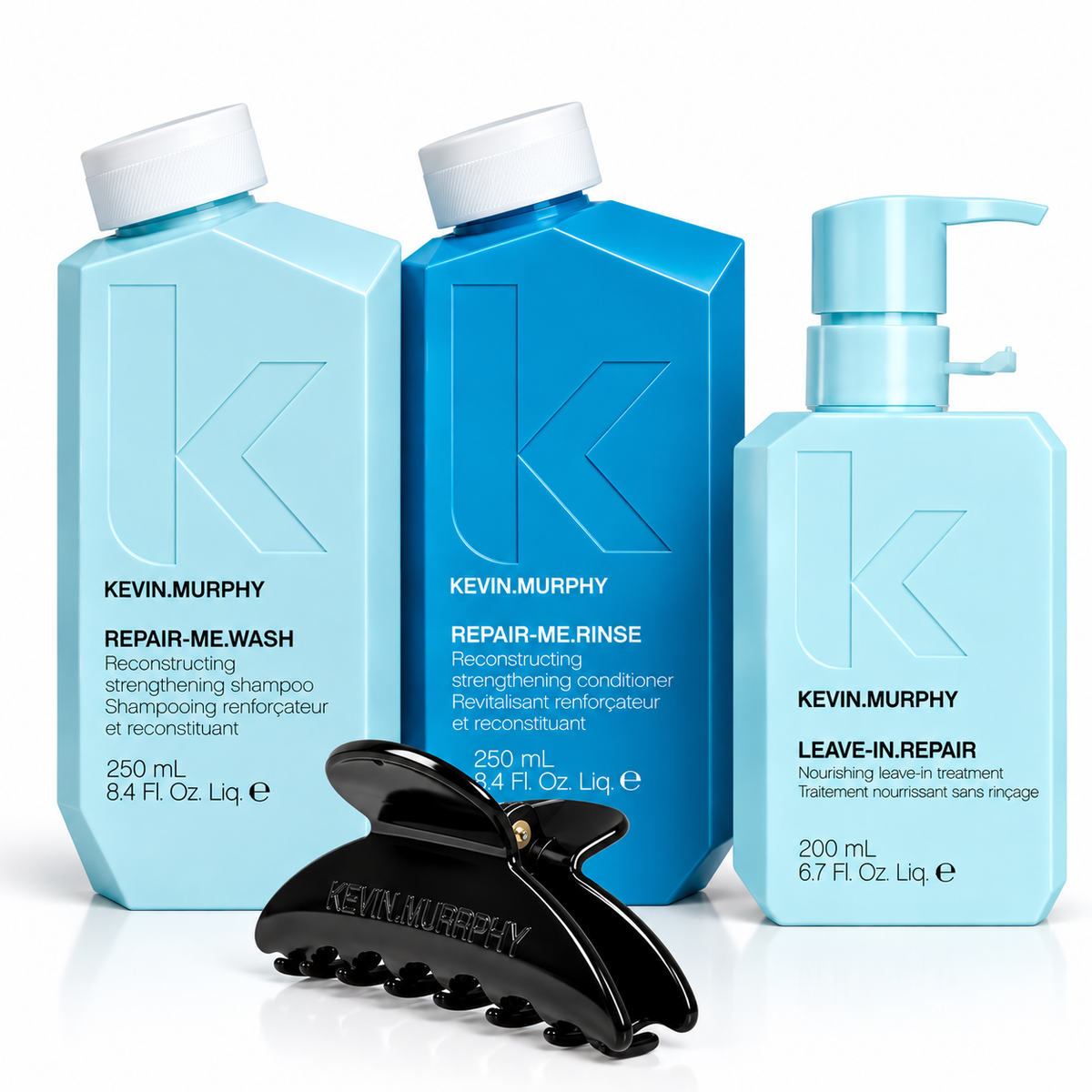 Kevin Murphy haircare set featuring Repair-Me Wash, Repair-Me Rinse, and Leave-In Repair in light blue and dark blue bottles, with a black claw hair clip in front on a white background - Hair Care Canada