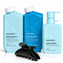 Kevin Murphy haircare set featuring Repair-Me Wash, Repair-Me Rinse, and Leave-In Repair in light blue and dark blue bottles, with a black claw hair clip in front on a white background - Hair Care Canada