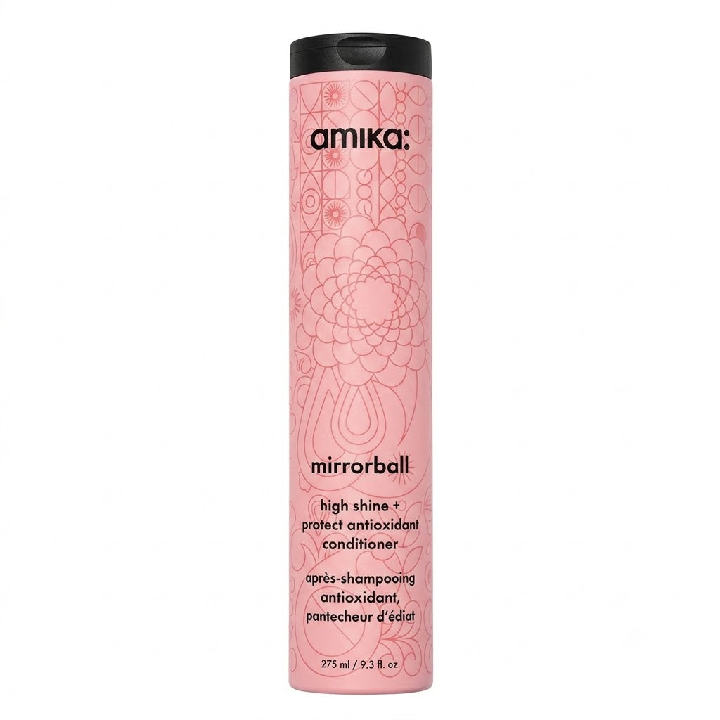 Pink bottle of amika mirrorball conditioner on a white background  Hair Care Canada