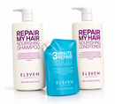 Three ELVEEN Australia hair care products on a white background: a large white pump bottle of Repair My Hair Nourishing Shampoo, a matching large white pump bottle of Repair My Hair Nourishing Conditioner, and a smaller bright blue squeeze pouch of 3 Minute Repair Rinse Out Treatment.