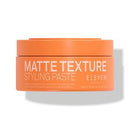 Orange jar of Matte Texture Styling Paste by Eleven on a white background-Hair Care Canada