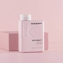 A pink Kevin Murphy Antigravity Shampoo bottle with a white cap, displayed next to a matching pink box on a solid pink background.